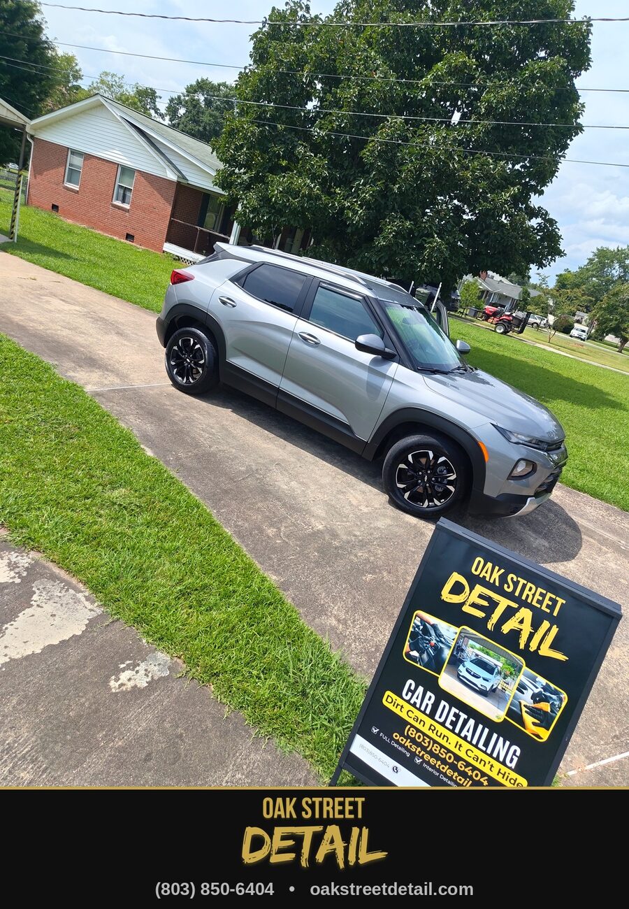 Chevy Trailblazer freshly detailed behind the Oak Street Detail sign